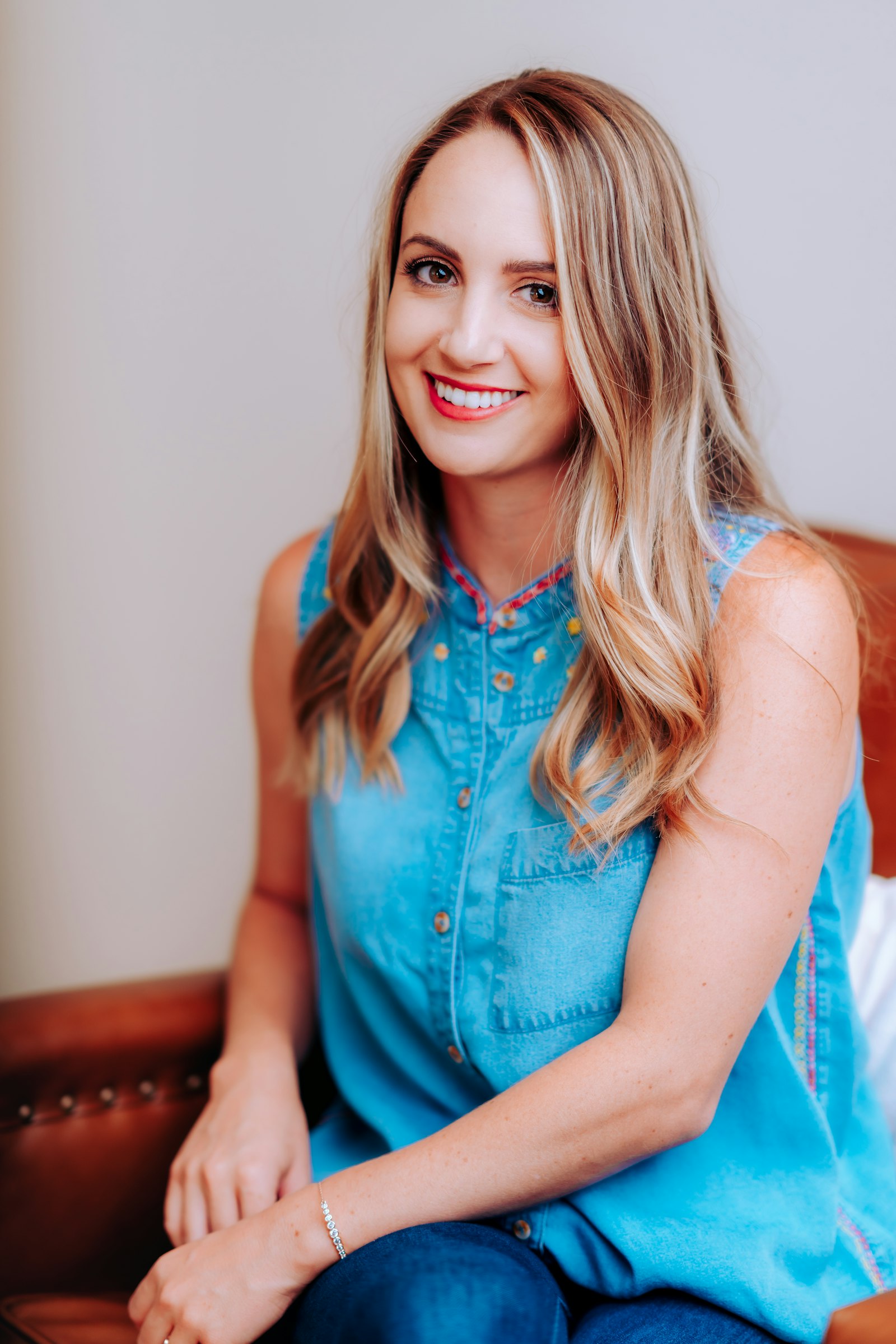 A woman relaxing comfortably on a couch at home